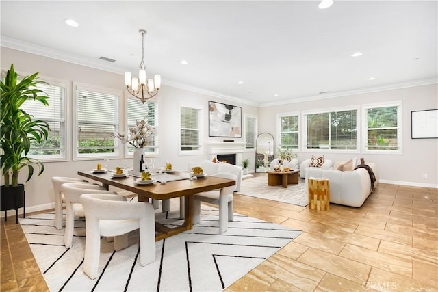 12 Starflower, Lake Forest, CA 92630 - dining area with a chandelier, ornamental molding, recessed lighting, and a lit fireplace