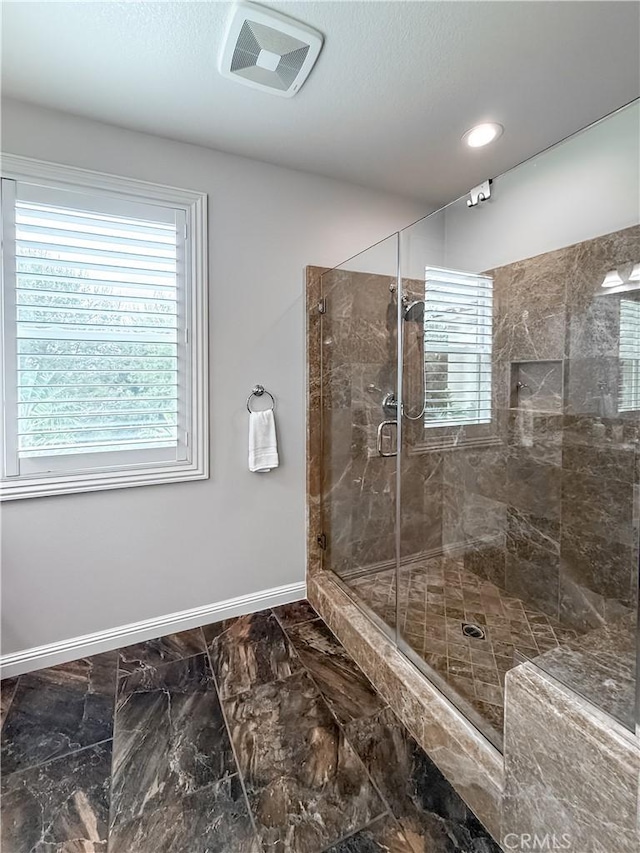 12 Starflower, Lake Forest, CA 92630 - full bathroom featuring a shower stall, marble finish flooring, and recessed lighting