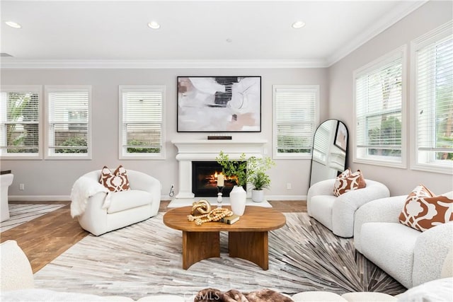 12 Starflower, Lake Forest, CA 92630 - living area with a lit fireplace, ornamental molding, recessed lighting, and wood finished floors