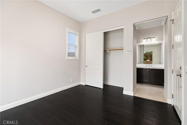 12 Starflower, Lake Forest, CA 92630 - unfurnished bedroom featuring wood finished floors, a closet, and attic access