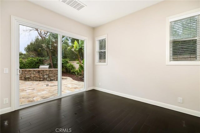 12 Starflower, Lake Forest, CA 92630 - spare room with baseboards and dark wood-type flooring
