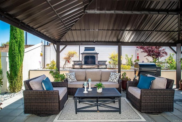view of patio / terrace featuring fence, a gazebo, and outdoor lounge area