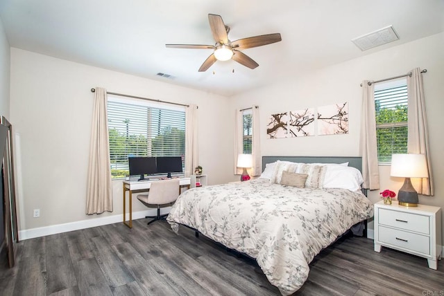 bedroom with baseboards, a ceiling fan, dark wood-style floors, and visible vents