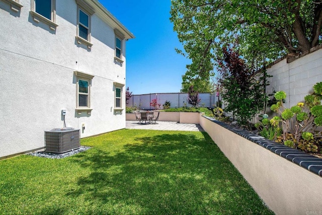view of yard with a patio, cooling unit, and a fenced backyard