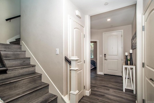 stairs featuring recessed lighting, baseboards, and wood finished floors