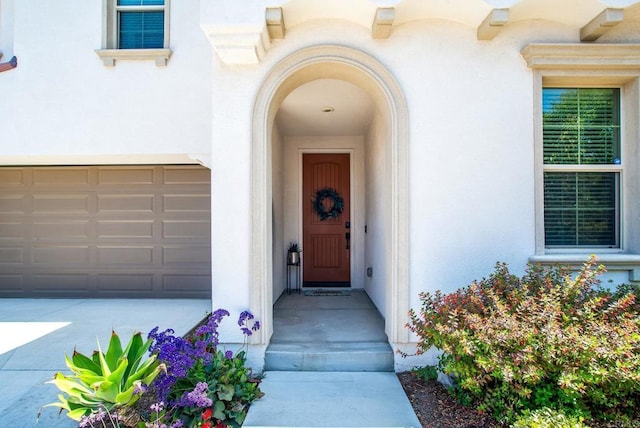 doorway to property with stucco siding