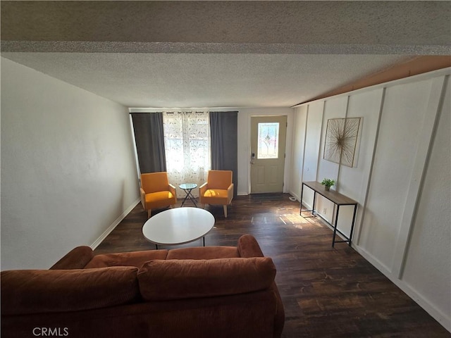 living area featuring baseboards and wood finished floors