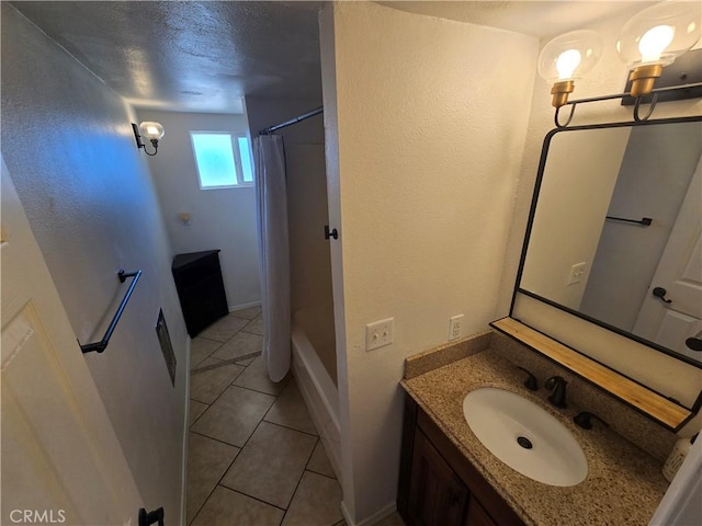 full bathroom featuring tile patterned floors, baseboards, vanity, and shower / bathtub combination with curtain