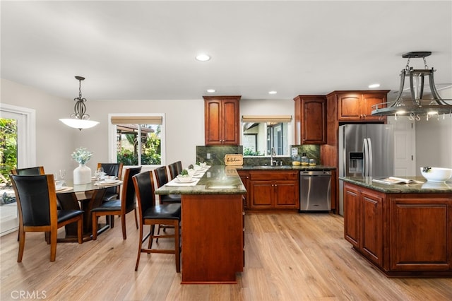 2465 Via Oeste Dr, Fallbrook, CA 92028 - kitchen featuring appliances with stainless steel finishes, plenty of natural light, light wood-style flooring, and recessed lighting