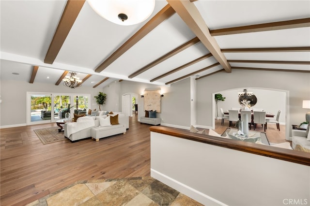 2465 Via Oeste Dr, Fallbrook, CA 92028 - living area with a chandelier, arched walkways, baseboards, and wood finished floors