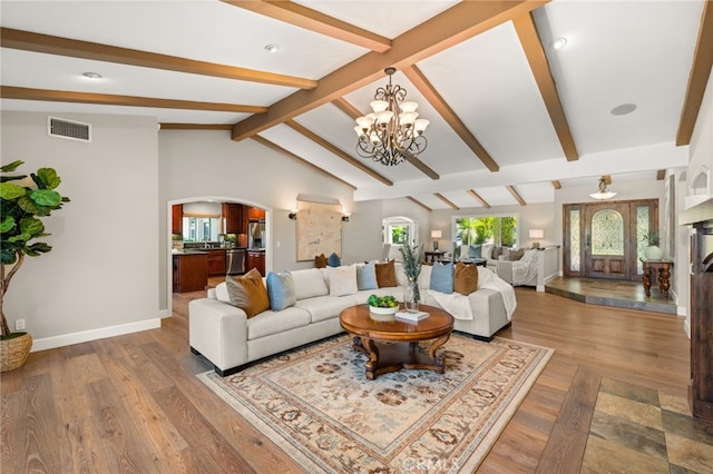 2465 Via Oeste Dr, Fallbrook, CA 92028 - living area featuring arched walkways, a chandelier, baseboards, and wood finished floors