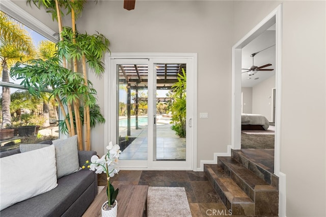 2465 Via Oeste Dr, Fallbrook, CA 92028 - doorway to outside featuring ceiling fan, stone finish flooring, and baseboards