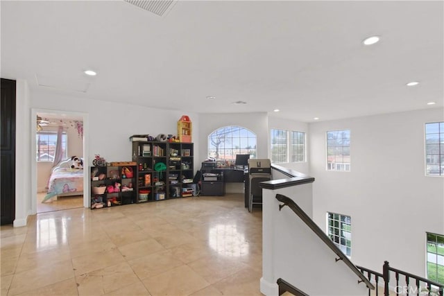 corridor featuring light tile patterned floors, visible vents, recessed lighting, and an upstairs landing