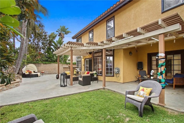 back of property with fence, a pergola, stucco siding, an outdoor living space, and a patio