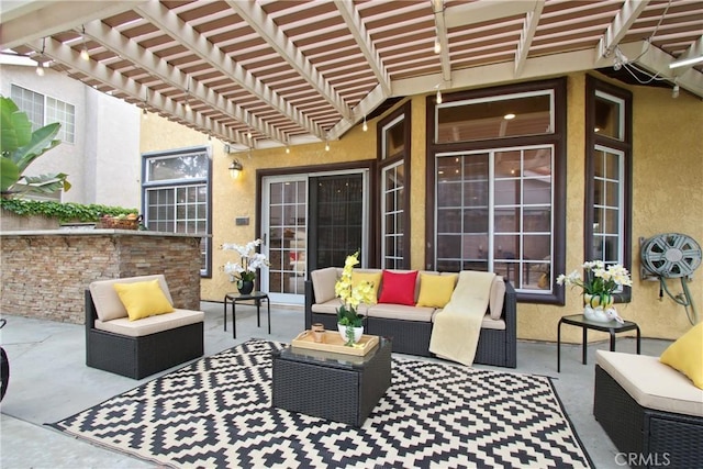view of patio / terrace featuring a pergola and an outdoor hangout area