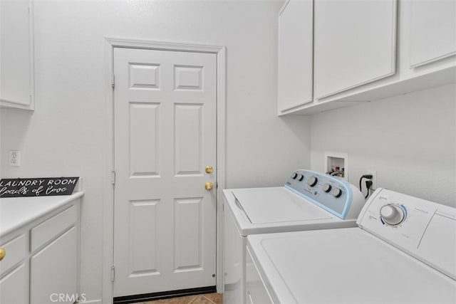 washroom featuring cabinet space and independent washer and dryer