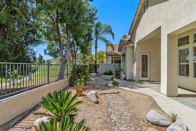 view of yard with a fenced backyard and a patio area