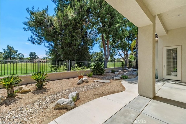 view of yard featuring a fenced backyard and a patio