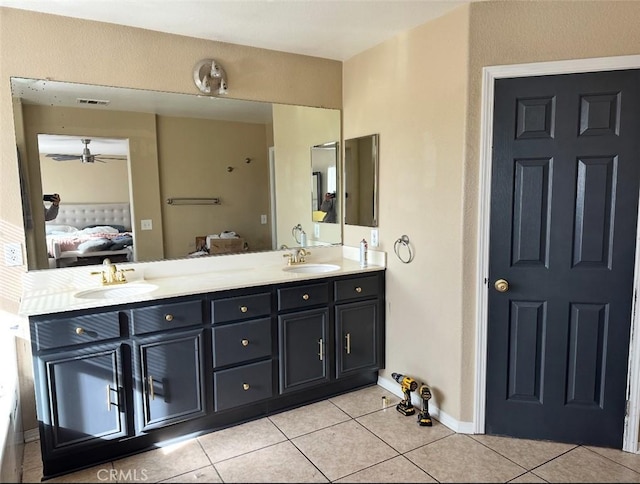 12369 Kern River Dr, Eastvale, CA 91752 - ensuite bathroom featuring connected bathroom, double vanity, tile patterned floors, and a sink
