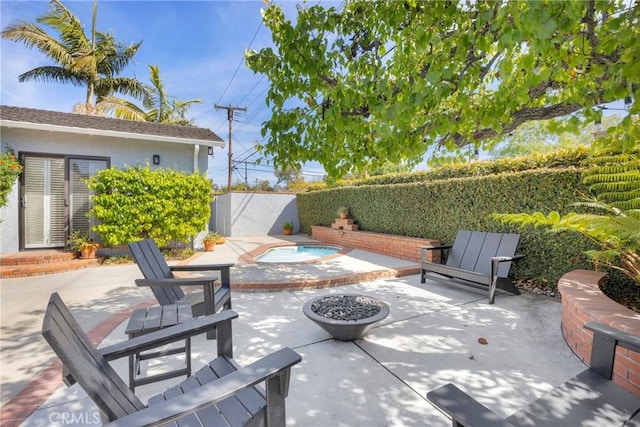 view of patio with a fenced backyard and a jacuzzi