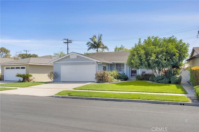 ranch-style house with a garage, stucco siding, driveway, and a front lawn