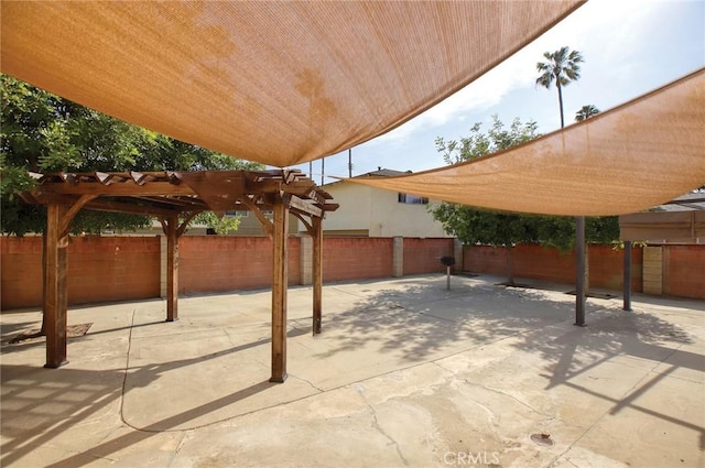 view of patio with a fenced backyard and a pergola