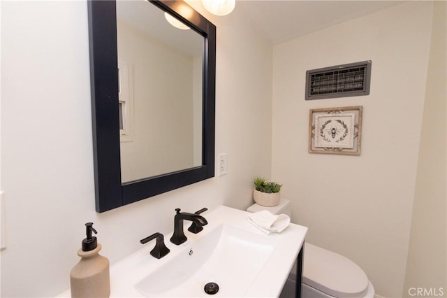 758 Elm St, Big Bear Lake, CA 92315 - bathroom with baseboards, vanity, toilet, and visible vents