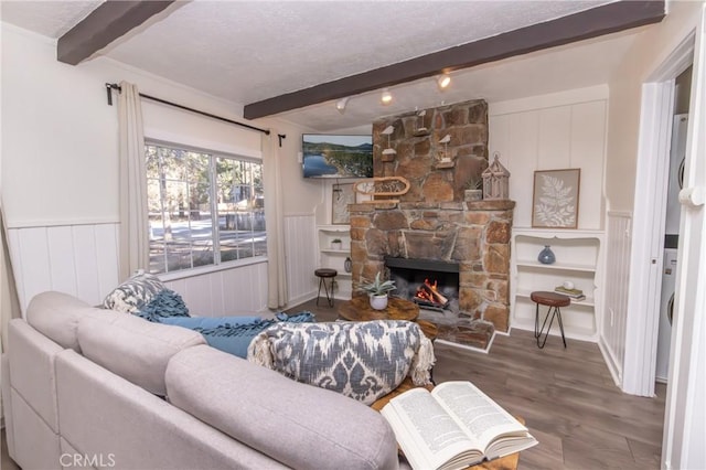 758 Elm St, Big Bear Lake, CA 92315 - living room with beamed ceiling, wainscoting, wood finished floors, and a fireplace
