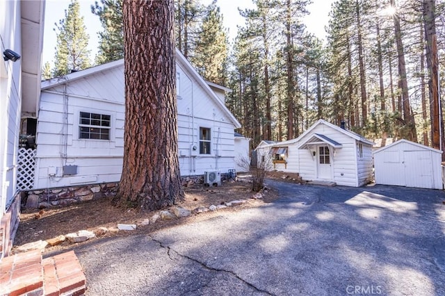 758 Elm St, Big Bear Lake, CA 92315 - view of property exterior featuring a storage shed and an outdoor structure