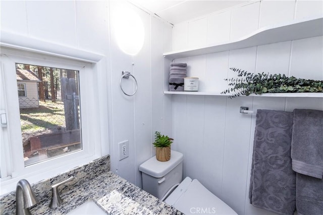 758 Elm St, Big Bear Lake, CA 92315 - bathroom with a sink, a decorative wall, and toilet