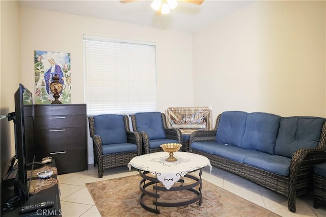 living area featuring a ceiling fan and light tile patterned flooring