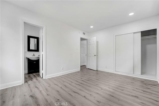 21733 Tuba St, Chatsworth, CA 91311 - unfurnished bedroom featuring a closet, recessed lighting, baseboards, and wood finished floors