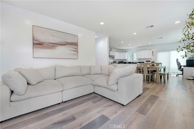 21733 Tuba St, Chatsworth, CA 91311 - living room with visible vents, recessed lighting, and light wood-type flooring