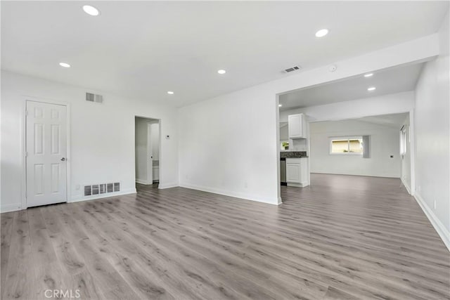 21733 Tuba St, Chatsworth, CA 91311 - unfurnished living room featuring light wood-type flooring, recessed lighting, and visible vents