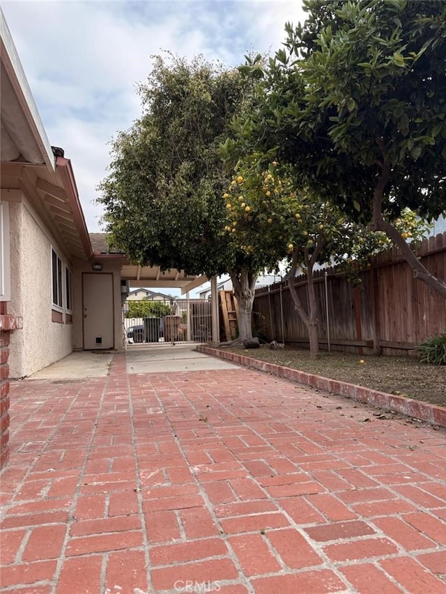 view of patio / terrace featuring fence