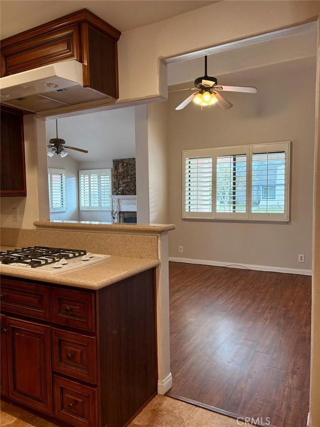 2615 Shalimar St, Camarillo, CA 93010 - kitchen featuring a ceiling fan, white gas cooktop, open floor plan, light wood-style flooring, and light countertops