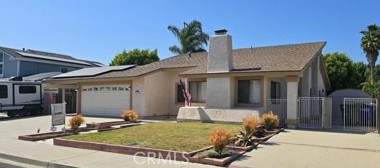 2615 Shalimar St, Camarillo, CA 93010 - ranch-style house featuring a garage, concrete driveway, roof mounted solar panels, a chimney, and a gate