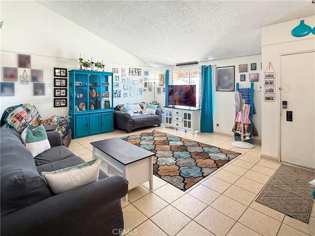 26731 Greenvale Way, Desert Center, CA 92239 - living area featuring a textured ceiling, light tile patterned flooring, and lofted ceiling