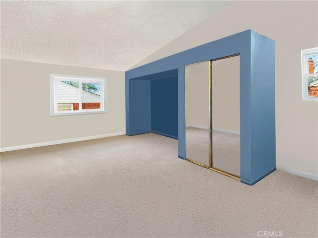 26731 Greenvale Way, Desert Center, CA 92239 - additional living space featuring a textured ceiling, lofted ceiling, carpet flooring, and baseboards