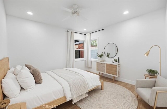 11867 S San Pedro St, Los Angeles, CA 90061 - bedroom with baseboards, recessed lighting, and wood finished floors