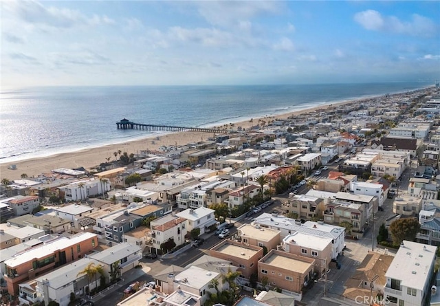 birds eye view of property featuring a beach view, a residential view, and a water view