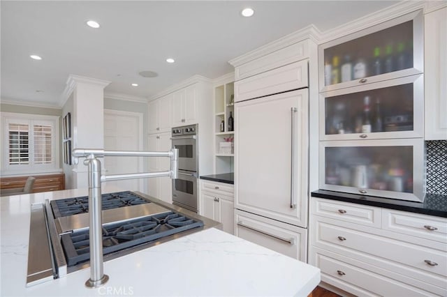 617 Crest Dr, Manhattan Beach, CA 90266 - kitchen featuring appliances with stainless steel finishes, white cabinets, crown molding, recessed lighting, and light stone counters