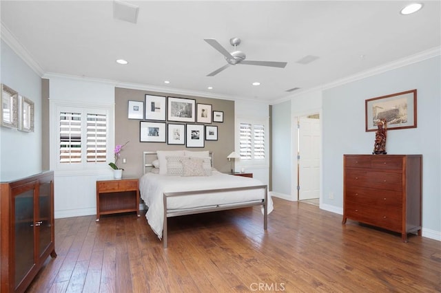 bedroom featuring wood-type flooring, recessed lighting, and crown molding