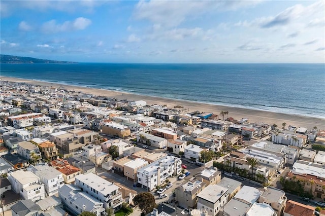 drone / aerial view with a water view and a view of the beach