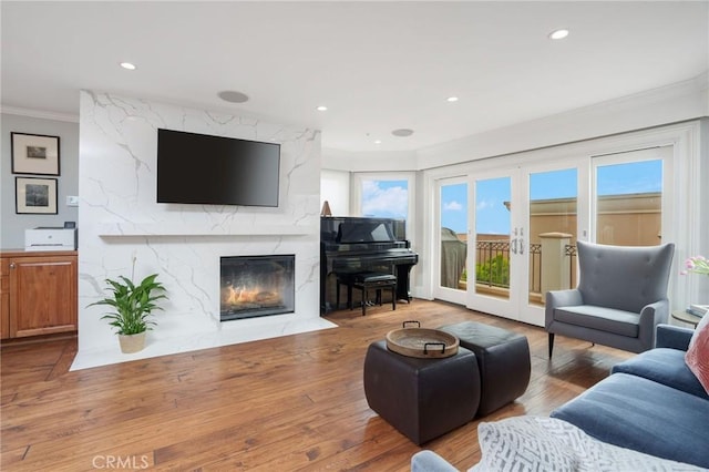 617 Crest Dr, Manhattan Beach, CA 90266 - living room featuring crown molding, a high end fireplace, healthy amount of natural light, wood finished floors, and recessed lighting