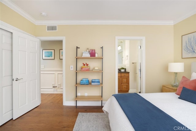 617 Crest Dr, Manhattan Beach, CA 90266 - bedroom featuring ornamental molding, dark wood-style flooring, and connected bathroom