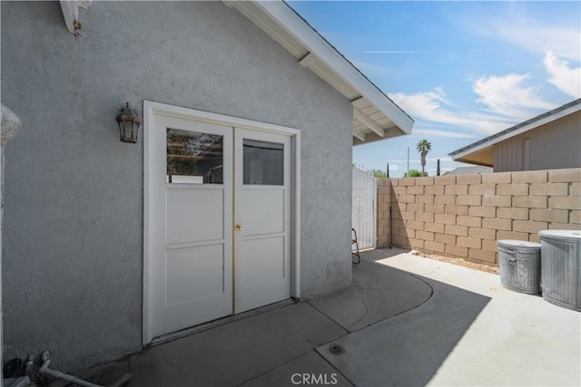 view of patio featuring fence