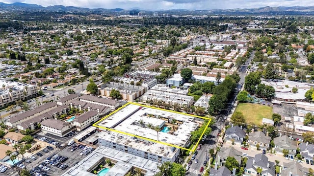 birds eye view of property with a mountain view
