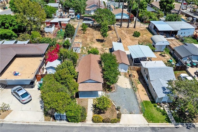 birds eye view of property with a residential view