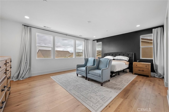 bedroom featuring recessed lighting, light wood-style flooring, and visible vents